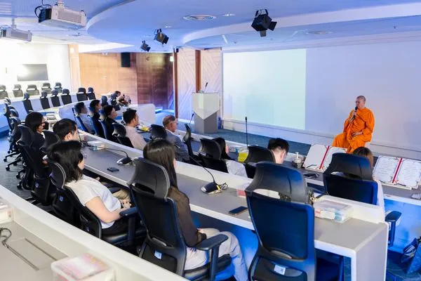 Participants meditating in their seats