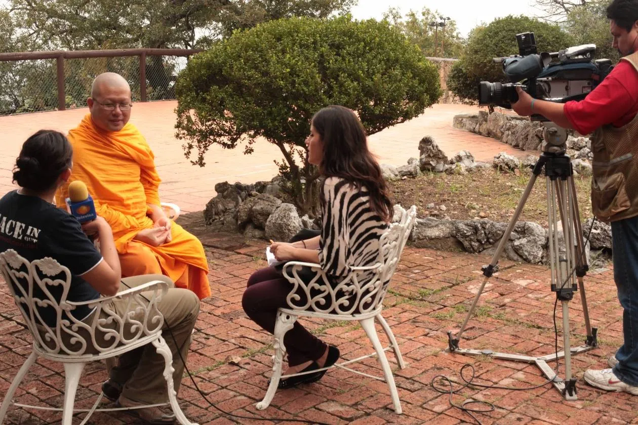 Giving a TV interview to a Televisa reporter in the garden at Chipinque