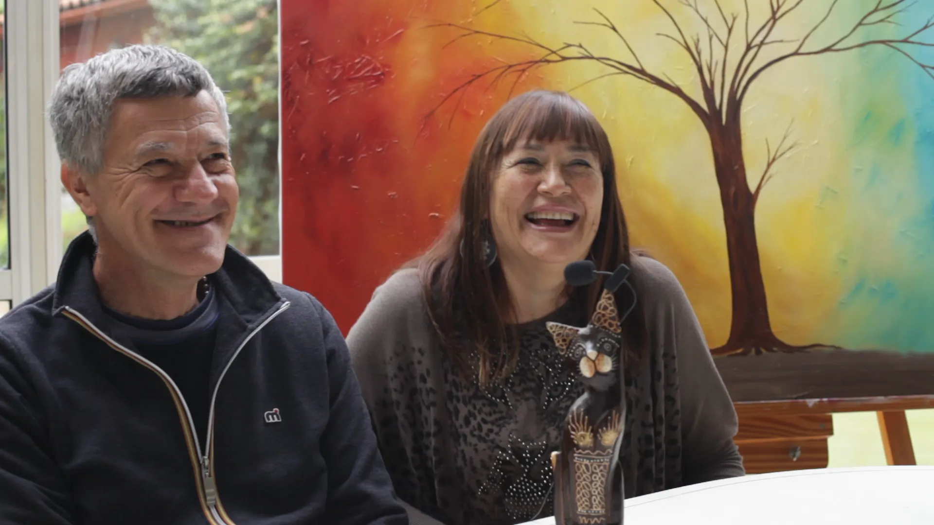 Diego's parents smiling during their interview