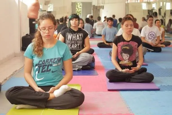 Students on yoga mats meditating at TEC de Monterrey