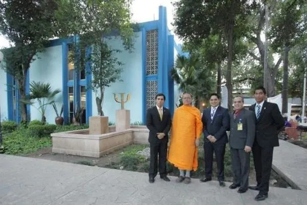 Standing with the dean of Psychology and university officials outside the faculty